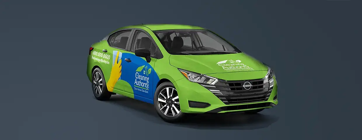 Nissan sedan with The Cleaning Authority vehicle wrap produced and installed by CG Detroit.